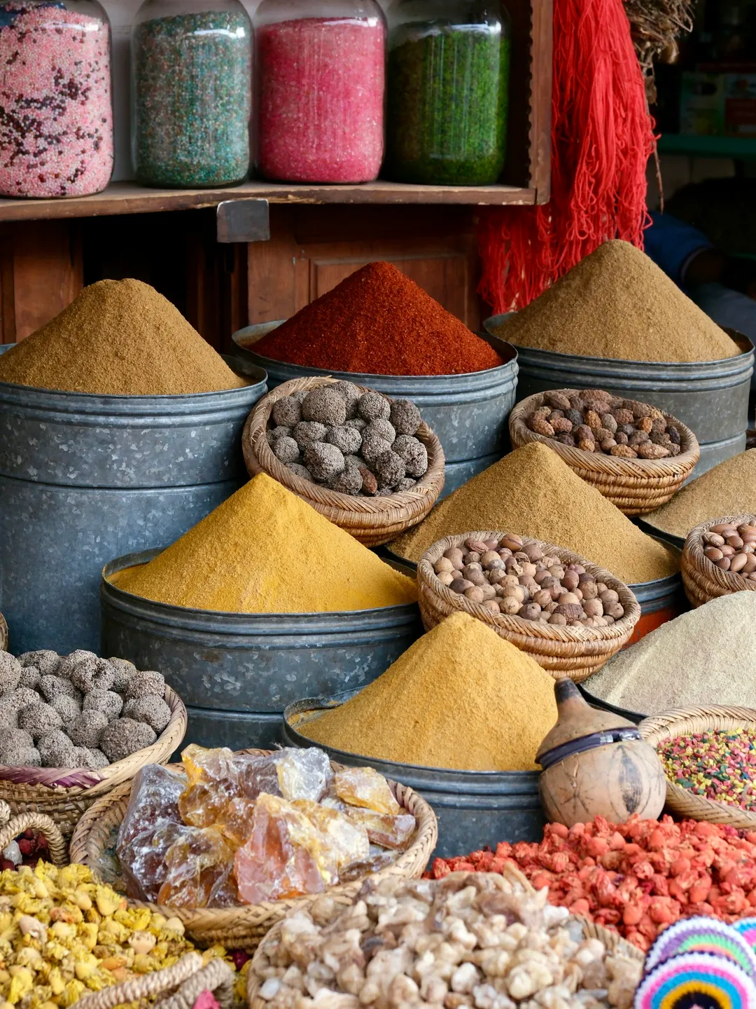 Colourful spices and dried goods displayed at a market